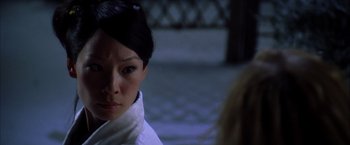 Movie still from “Kill Bill: Vol. 1” (2003), directed by Quentin Tarantino – A person wearing a white scarf; Close Up shot, Over the shoulder angle