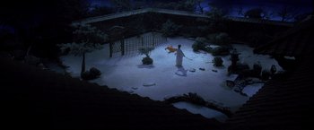 Movie still from “Kill Bill: Vol. 1” (2003), directed by Quentin Tarantino – A man standing in the snow holding a sword; Extreme Wide shot, High angle