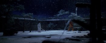 Movie still from “Kill Bill: Vol. 1” (2003), directed by Quentin Tarantino – Two people are standing in the snow at night; Extreme Wide shot, Low angle