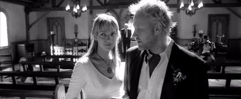 Movie still from “Kill Bill: Vol. 2” (2004), directed by Quentin Tarantino – Black and white photograph of a man and a woman; Close Up shot, Low angle