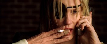 Movie still from “Kill Bill: Vol. 2” (2004), directed by Quentin Tarantino – A person holding a cigarette in her mouth; Extreme Close Up shot, Overhead angle