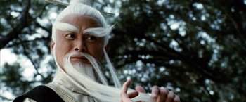 Movie still from “Kill Bill: Vol. 2” (2004), directed by Quentin Tarantino – A man with a long white hair and a long white beard; Close Up shot, Low angle