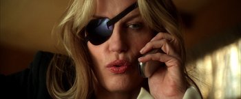 Movie still from “Kill Bill: Vol. 2” (2004), directed by Quentin Tarantino – A person talking on a cell phone; Close Up shot, Low angle