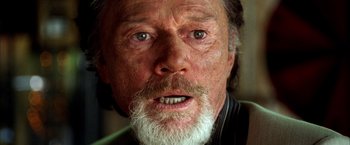 Movie still from “Kill Bill: Vol. 2” (2004), directed by Quentin Tarantino – An old man with a beard and a white mustache; Close Up shot, Low angle