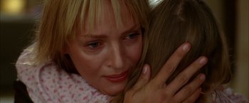 Movie still from “Kill Bill: Vol. 2” (2004), directed by Quentin Tarantino – A person hugging another person; Close Up shot, Low angle