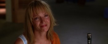 Movie still from “Kill Bill: Vol. 2” (2004), directed by Quentin Tarantino – A person with blonde hair; Close Up shot, Low angle