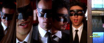 Movie still from “Kill Bill: Vol. 2” (2004), directed by Quentin Tarantino – A series of photos of a man wearing a black mask; Close Up shot, Low angle