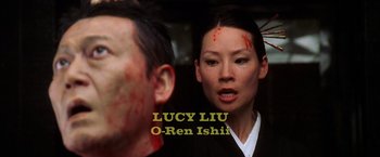 Movie still from “Kill Bill: Vol. 2” (2004), directed by Quentin Tarantino – A woman with blood all over her face and a man with blood all over his face; Close Up shot, Over the shoulder angle