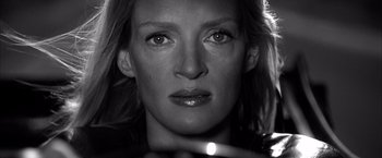 Movie still from “Kill Bill: Vol. 2” (2004), directed by Quentin Tarantino – Black and white photograph of a woman's face; Close Up shot, Low angle