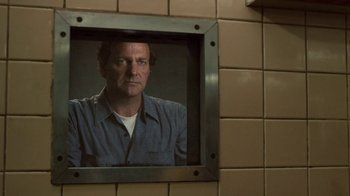 Movie still from “Kill the Irishman” (2011), directed by Jonathan Hensleigh – A man is looking into a mirror in a bathroom; Close Up shot, Over the shoulder angle