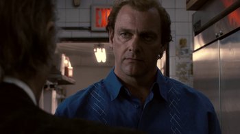 Movie still from “Kill the Irishman” (2011), directed by Jonathan Hensleigh – A person wearing a blue shirt; Close Up shot, Over the shoulder angle