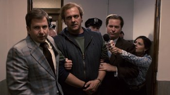 Movie still from “Kill the Irishman” (2011), directed by Jonathan Hensleigh – A group of men standing next to each other in a room; Medium shot, Low angle