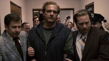 Movie still from “Kill the Irishman” (2011), directed by Jonathan Hensleigh – A group of men standing next to each other in front of a mirror; Medium shot, Low angle