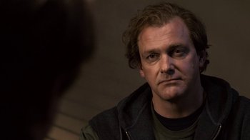 Movie still from “Kill the Irishman” (2011), directed by Jonathan Hensleigh – A person wearing a jacket; Close Up shot, Over the shoulder angle