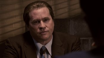 Movie still from “Kill the Irishman” (2011), directed by Jonathan Hensleigh – A person wearing a suit and tie; Close Up shot, Over the shoulder angle