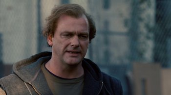 Movie still from “Kill the Irishman” (2011), directed by Jonathan Hensleigh – A person wearing a jacket; Close Up shot, Over the shoulder angle