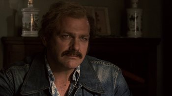 Movie still from “Kill the Irishman” (2011), directed by Jonathan Hensleigh – A person wearing a jean jacket; Close Up shot, Over the shoulder angle