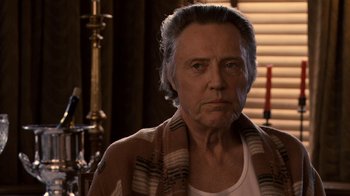 Movie still from “Kill the Irishman” (2011), directed by Jonathan Hensleigh – An older woman with a scarf around her neck; Close Up shot, Over the shoulder angle