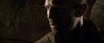 Movie still from “Killer Elite” (2011), directed by Gary McKendry – A person with a beard; Close Up shot, Low angle