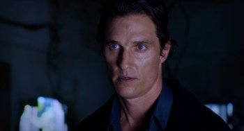 Movie still from “Killer Joe” (2011), directed by William Friedkin – A person wearing a suit and tie; Close Up shot, Over the shoulder angle