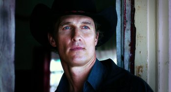 Movie still from “Killer Joe” (2011), directed by William Friedkin – A person wearing a cowboy hat; Close Up shot, Low angle