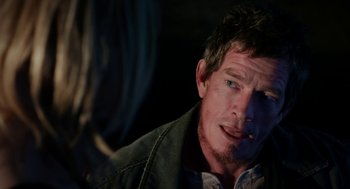 Movie still from “Killer Joe” (2011), directed by William Friedkin – A person smoking a cigarette; Close Up shot, Over the shoulder angle