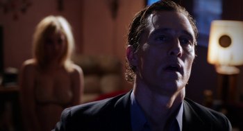 Movie still from “Killer Joe” (2011), directed by William Friedkin – A person wearing a suit and tie; Close Up shot, Low angle