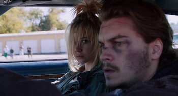 Movie still from “Killer Joe” (2011), directed by William Friedkin – A man and a woman sitting in the back of a car; Close Up shot, Over the shoulder angle