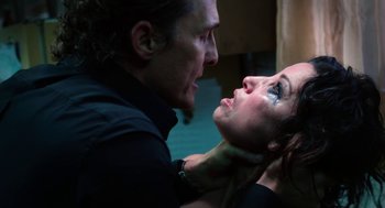 Movie still from “Killer Joe” (2011), directed by William Friedkin – A man and a woman are looking at one another; Close Up shot, Over the shoulder angle