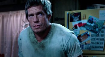 Movie still from “Killer Joe” (2011), directed by William Friedkin – A person wearing a t - shirt; Close Up shot, Over the shoulder angle