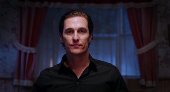 Movie still from “Killer Joe” (2011), directed by William Friedkin – A person wearing a black shirt; Close Up shot, Low angle