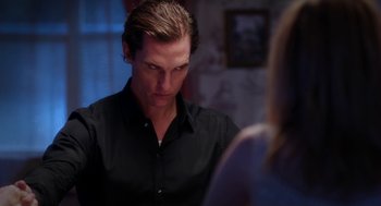 Movie still from “Killer Joe” (2011), directed by William Friedkin – A person wearing a black shirt; Close Up shot, Over the shoulder angle