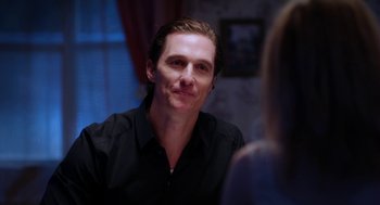 Movie still from “Killer Joe” (2011), directed by William Friedkin – A person wearing a black shirt; Close Up shot, Over the shoulder angle