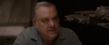 Movie still from “Killing Them Softly” (2012), directed by Andrew Dominik – An older man is looking at the camera; Close Up shot, Low angle