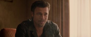 Movie still from “Killing Them Softly” (2012), directed by Andrew Dominik – A person wearing a leather jacket; Close Up shot, Over the shoulder angle