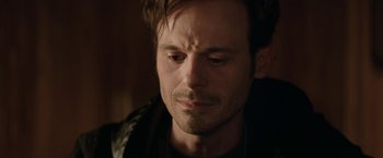 Movie still from “Killing Them Softly” (2012), directed by Andrew Dominik – A person with his eyes wide open; Close Up shot, Over the shoulder angle