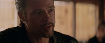 Movie still from “Killing Them Softly” (2012), directed by Andrew Dominik – A person with a beard; Close Up shot, Over the shoulder angle