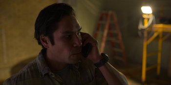 Movie still from “Kimi” (2022), directed by Steven Soderbergh – A person talking on a cell phone; Close Up shot, Low angle