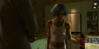 Movie still from “Kimi” (2022), directed by Steven Soderbergh – A woman with blue hair standing next to a man; Medium shot, Over the shoulder angle