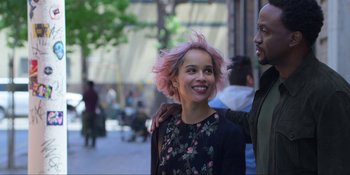 Movie still from “Kimi” (2022), directed by Steven Soderbergh – A woman standing next to a man on a sidewalk; Close Up shot, Over the shoulder angle