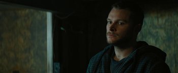 Movie still from “Kin” (2018), directed by Josh Baker – A person looking at the camera; Close Up shot, Low angle