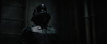 Movie still from “Kin” (2018), directed by Josh Baker – A man in a helmet is posing for a picture; Close Up shot, Low angle