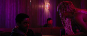 Movie still from “Kin” (2018), directed by Josh Baker – Two people sitting at a table in a restaurant; Close Up shot, Over the shoulder angle