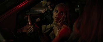 Movie still from “Kin” (2018), directed by Josh Baker – A woman sitting in the driver's seat of a car; Close Up shot, Over the shoulder angle
