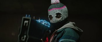 Movie still from “Kin” (2018), directed by Josh Baker – A person wearing a knitted hat with a pom pom; Close Up shot, Low angle
