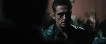 Movie still from “Kin” (2018), directed by Josh Baker – A person wearing a jacket; Close Up shot, Over the shoulder angle