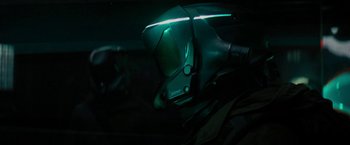 Movie still from “Kin” (2018), directed by Josh Baker – A helmet that is lit up in the dark; Close Up shot, Over the shoulder angle