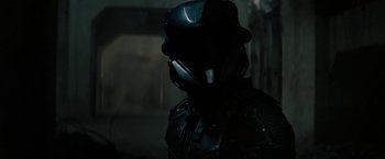 Movie still from “Kin” (2018), directed by Josh Baker – A person wearing a helmet; Close Up shot, Over the shoulder angle