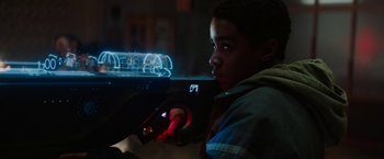 Movie still from “Kin” (2018), directed by Josh Baker – A young boy is holding a remote control car; Close Up shot, Low angle