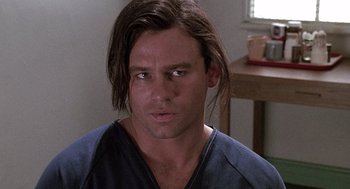Movie still from “Kindergarten Cop” (1990), directed by Ivan Reitman – A person with long brown hair; Close Up shot, Low angle